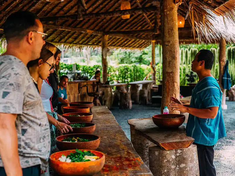 Staff explaining to visitors during the feeding program