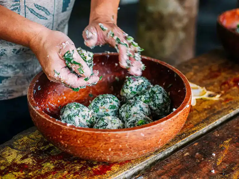 Creating nutritious rice balls for the elephants